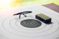 Paper shooting target with bullet and protection glassess Royalty Free Stock Photo