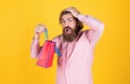 Paper shopping bag. birthday surprise at party. man with package. prepare for holidays. best sale offer. happy bearded Royalty Free Stock Photo