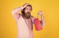 Paper shopping bag. birthday surprise at party. man with package. prepare for holidays. best sale offer. happy bearded Royalty Free Stock Photo