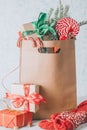 Paper shopping bag full of gift boxes Christmas ornamented