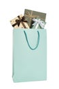 Paper shopping bag full of gift boxes isolated on white Royalty Free Stock Photo