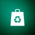Paper shopping bag with recycle symbol icon isolated on green background. Flat design. Vector Royalty Free Stock Photo