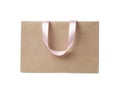 Paper shopping bag with ribbon handles on white background Royalty Free Stock Photo