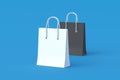 Paper shopping bags black and white color. Product discounts. Big sale