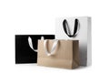 Paper Shopping Bags With Ribbon Handles On White Background.