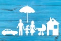 Paper silhouette of family with baby carriage under umbrella Royalty Free Stock Photo