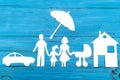 Paper silhouette of family with baby carriage under umbrella Royalty Free Stock Photo