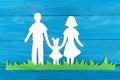 Paper silhouette of a family standing on the green grass Royalty Free Stock Photo