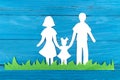 Paper silhouette of a family standing on the green grass Royalty Free Stock Photo