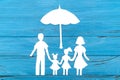 Paper silhouette of family under umbrella Royalty Free Stock Photo