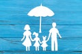 Paper silhouette of family under umbrella Royalty Free Stock Photo