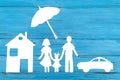 Paper silhouette of family under umbrella Royalty Free Stock Photo