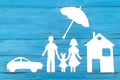 Paper silhouette of family under umbrella Royalty Free Stock Photo