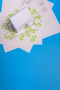 Paper skyscrapers , us dollar money, house projects plan and blueprints on blue background paper. Minimalistic and simple concept Royalty Free Stock Photo