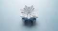 A paper snowflake with intricate geometric patterns sits on a light blue surface. The snowflake is Royalty Free Stock Photo