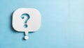 Paper speech bubble with question mark on light blue background, top view. Space for text Royalty Free Stock Photo