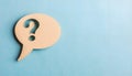 Paper speech bubble with question mark on light blue background, top view. Space for text Royalty Free Stock Photo