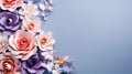 Paper spring flowers on blue background with copy space
