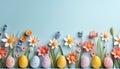 paper spring flowers and Easter colorful eggs on blue background, greeting pastel card with copy space Royalty Free Stock Photo