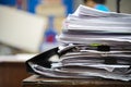 Paper stack on the desk related to business