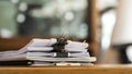 Paper stack on the desk related to business functions