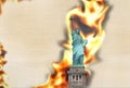 Paper Statue of Liberty texture fire flames burning background Royalty Free Stock Photo