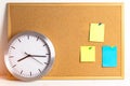Paper sticker note on cortical board with metal clock. Time to plannig concept, closedup. Blank notes for add text message or desi