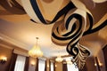 paper streamer hanging from ceiling in elegant hotel banquet room