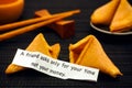 Paper strip with phrase A Friend Asks Only for Your Time not Your Money. from fortune cookie Royalty Free Stock Photo