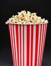 Paper Striped Bucket of Popcorn on a Sleek Black Background.