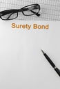 Paper with Surety Bond on a table Royalty Free Stock Photo