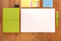 Paper, table, pen, notebook, stickers. White paper on the table. Notebook. Template for message. Green style