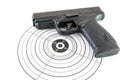 Paper target and black gun on white Royalty Free Stock Photo