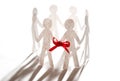Paper team linked together with red bow Royalty Free Stock Photo