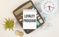 Paper with text Loyalty Program on the table