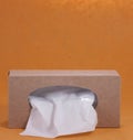 Paper tissue box on orange background Royalty Free Stock Photo