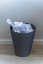 Paper trash. crumple paper falling to the recycling bin, Was thrown to basket bin, Overflowing waste paper in office Royalty Free Stock Photo