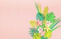 Paper tropical leaves and flowers over pink pastel background. Summer exotic vacation, greeting card mockup