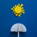 Paper umbrellas under sun. Origami. Sun protection and summer vacation concept