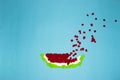 paper watermelon slice on blue background, slice splashing, creative art summer concept Royalty Free Stock Photo