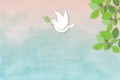 Paper white dove or pigeon carrying olive branch flying in sky colorful background, Concept for World Peace Day. Royalty Free Stock Photo