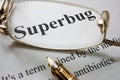 Paper with word superbug and glasses. Royalty Free Stock Photo