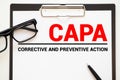 Paper with words CAPA Corrective and Preventive action plans