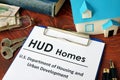 Paper with words HUD homes