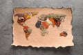 Paper with world map made of different aromatic spices Royalty Free Stock Photo