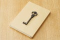 Paperback and old antique key Royalty Free Stock Photo