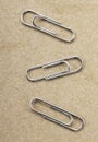 Paperclips on yellow background texture Royalty Free Stock Photo