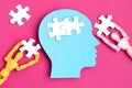 Papercut head with jigsaw puzzle pieces inside. Mental health problems, psychology, memory, logic, thinking process, solution, Royalty Free Stock Photo