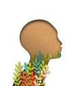 Papercut woman head with colorful paper leaves