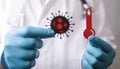 Papercuts of a blood test tube and virus-cell in the hands of a doctor with medical gloves Royalty Free Stock Photo